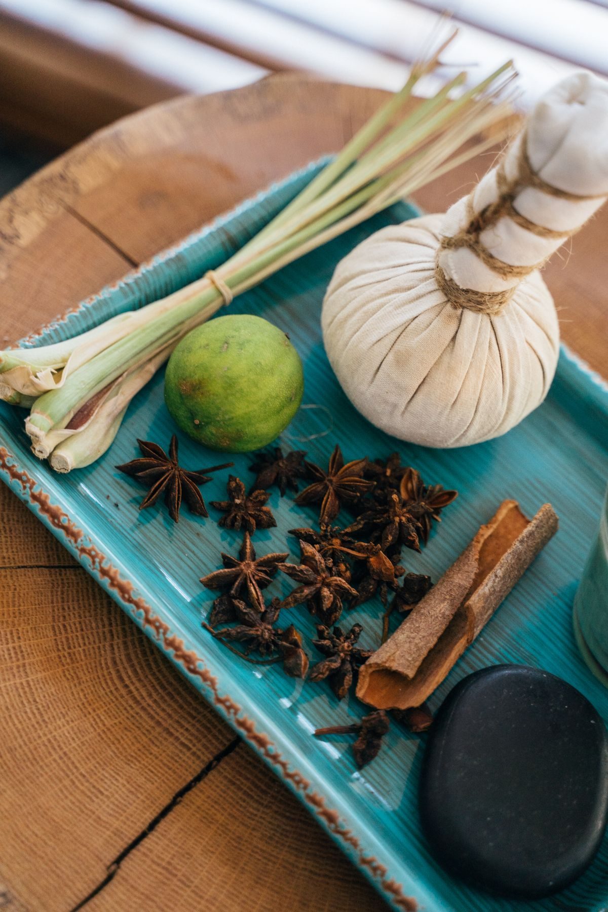 Herbal compress ingredients on a wooden table